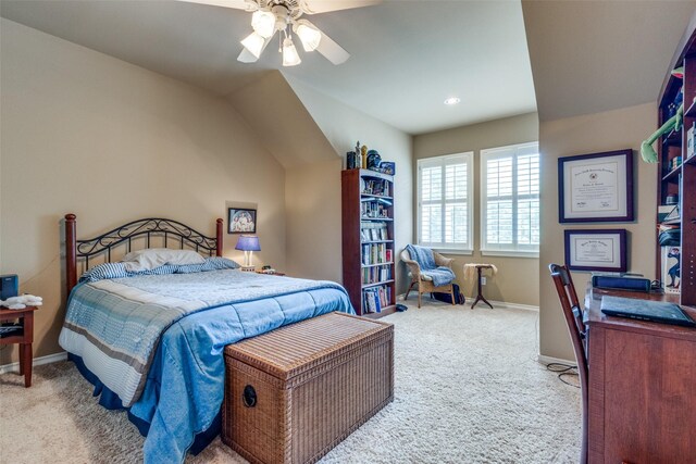 bedroom with carpet, ceiling fan, and vaulted ceiling