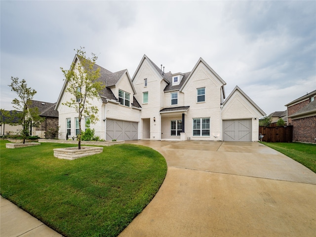 view of front of house featuring a garage and a front yard