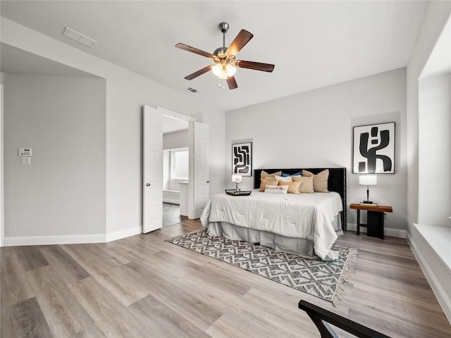 bedroom with light wood-type flooring and ceiling fan