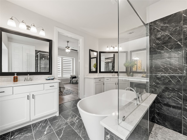 bathroom featuring vanity, separate shower and tub, and ceiling fan