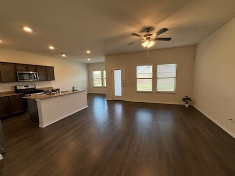 kitchen with dark hardwood / wood-style flooring, dark brown cabinetry, ceiling fan, and stainless steel appliances