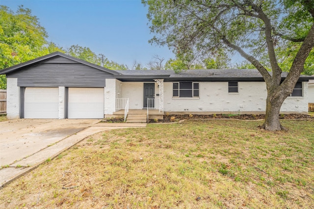 ranch-style house with an attached garage, brick siding, driveway, and a front yard