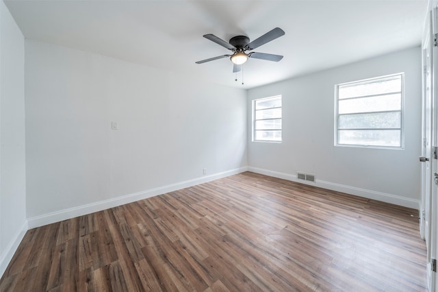 spare room with ceiling fan and hardwood / wood-style floors