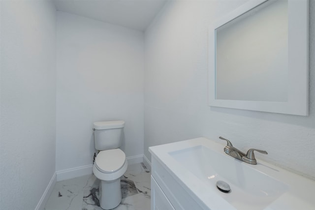 bathroom featuring toilet and vanity