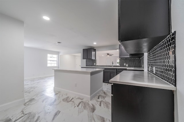 kitchen featuring a kitchen island and backsplash