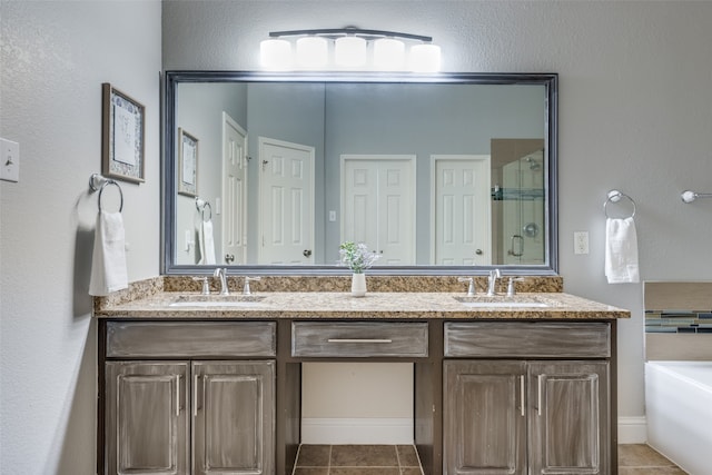 bathroom with vanity, tile patterned floors, and independent shower and bath