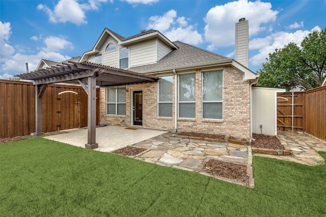 rear view of property featuring a pergola, a patio, and a lawn