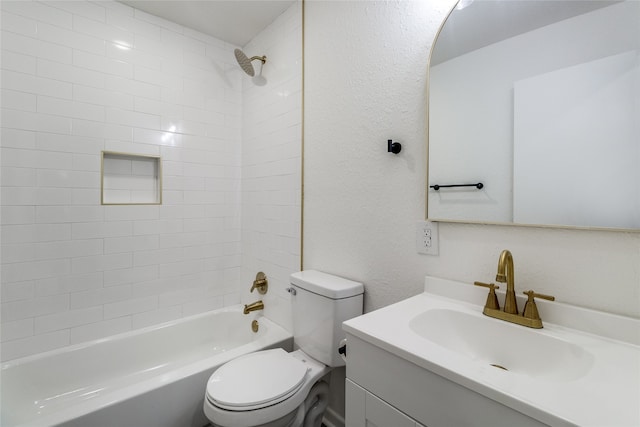 full bathroom with tiled shower / bath combo, vanity, and toilet