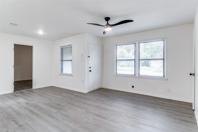 empty room featuring ceiling fan and wood-type flooring