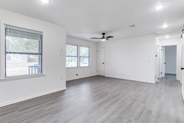 empty room featuring ceiling fan and hardwood / wood-style flooring