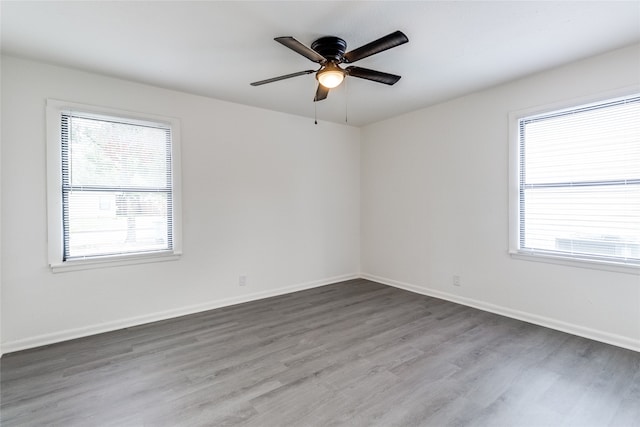 unfurnished room with hardwood / wood-style flooring and ceiling fan