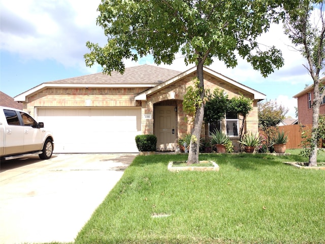 ranch-style home featuring a front yard and a garage