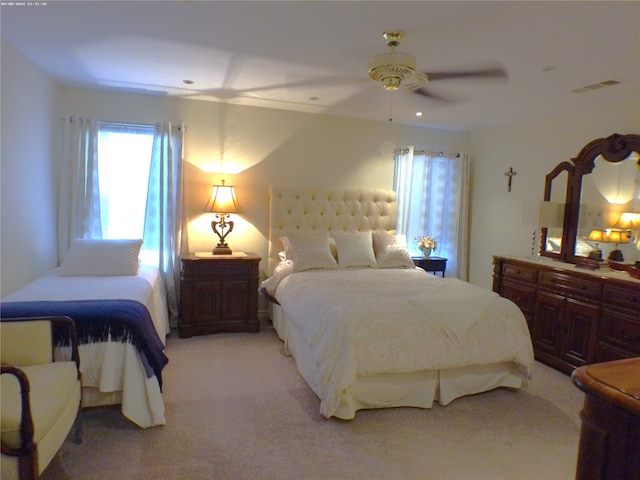 bedroom with ceiling fan and carpet floors