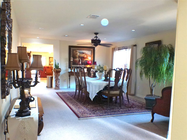 dining room featuring ceiling fan and carpet floors