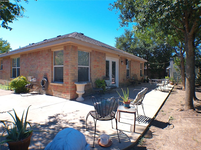 back of house with a patio