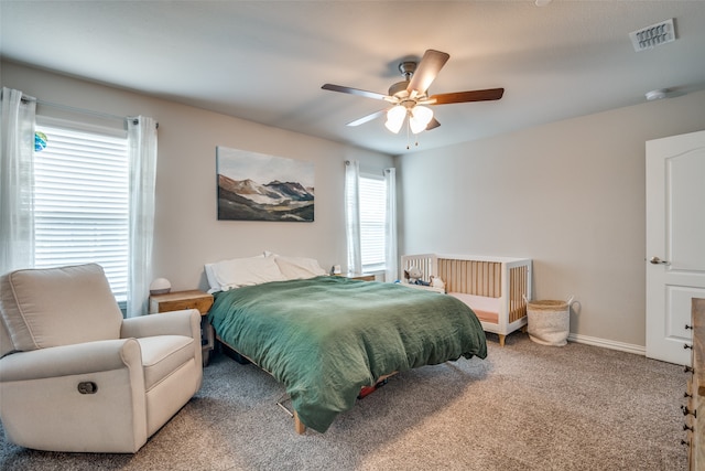 carpeted bedroom with ceiling fan