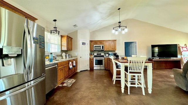 kitchen with appliances with stainless steel finishes, backsplash, decorative light fixtures, vaulted ceiling, and a breakfast bar