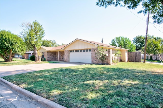 ranch-style home featuring a front yard and a garage