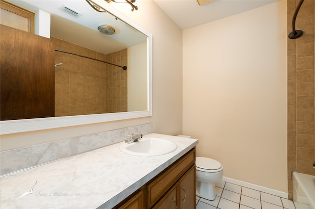 full bathroom with tile patterned floors, vanity, toilet, and tiled shower / bath combo