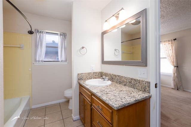 full bathroom with washtub / shower combination, a textured ceiling, vanity, tile patterned flooring, and toilet