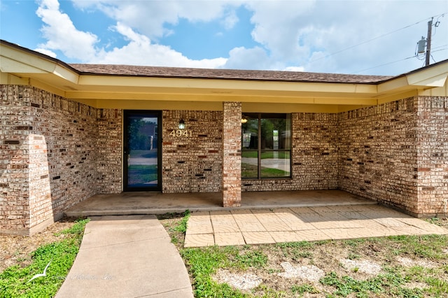 entrance to property with a patio area