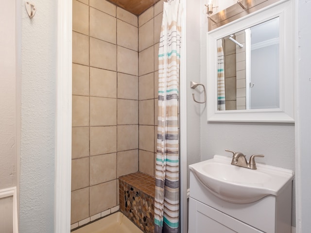 bathroom featuring vanity and a shower with shower curtain