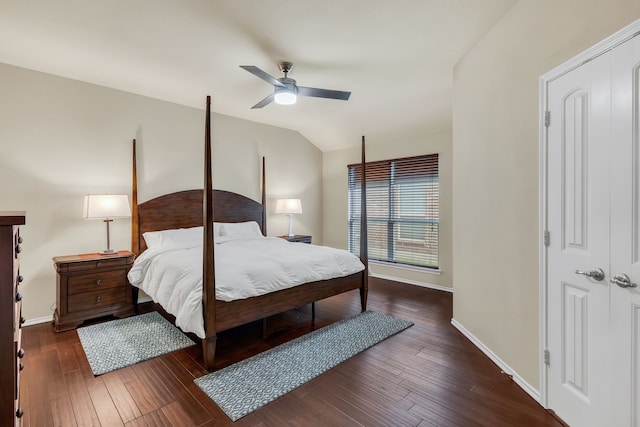 bedroom with a closet, dark hardwood / wood-style flooring, ceiling fan, and lofted ceiling