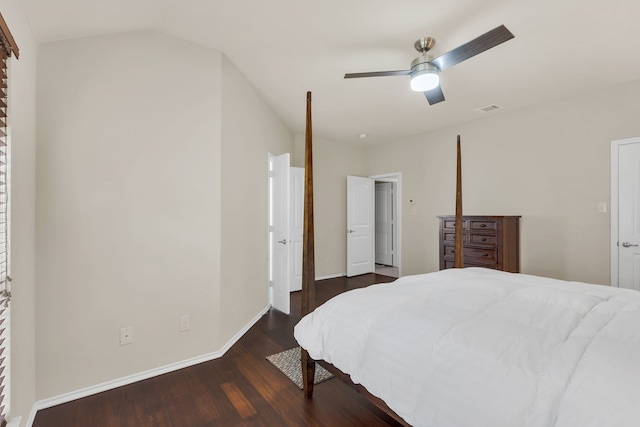 bedroom with ceiling fan, dark hardwood / wood-style flooring, and vaulted ceiling