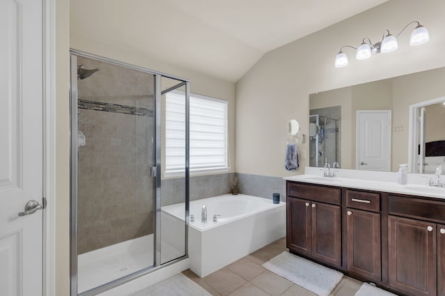 bathroom with vanity, lofted ceiling, separate shower and tub, and tile patterned flooring