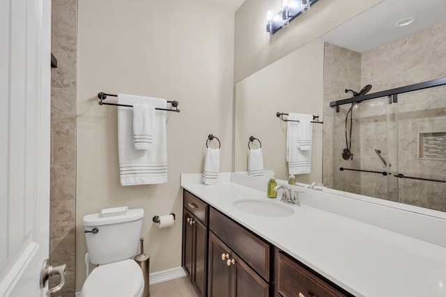 bathroom featuring vanity, toilet, an enclosed shower, and tile patterned flooring