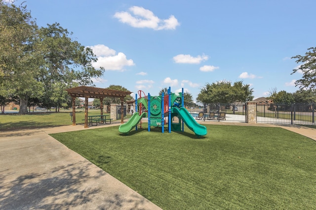 view of playground with a lawn