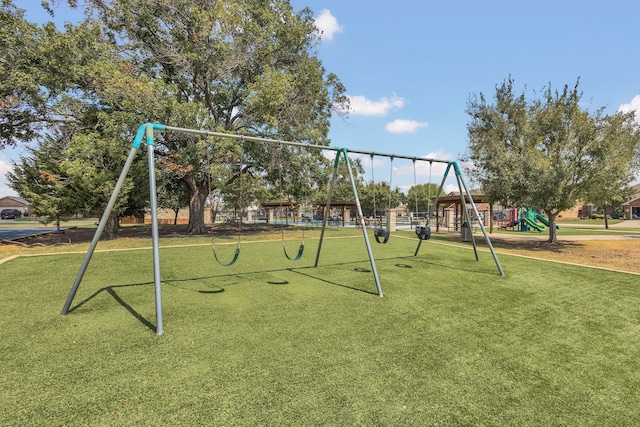 view of jungle gym with a lawn