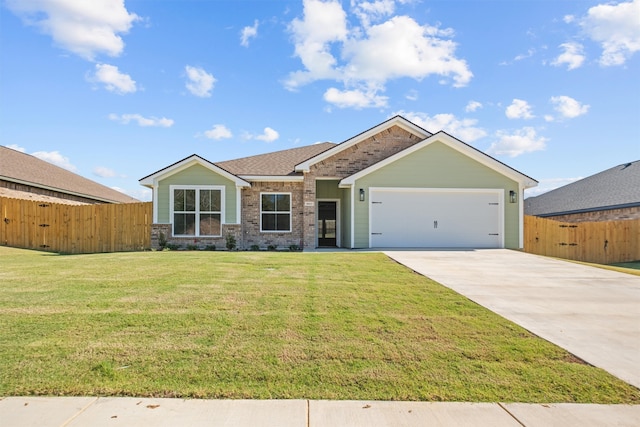 view of front facade with a garage and a front yard