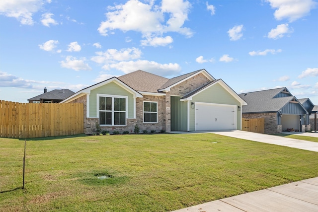 view of front of property featuring a garage and a front yard