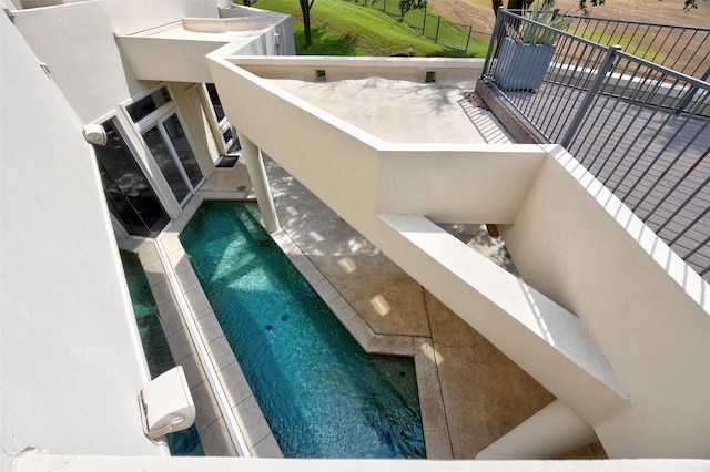 exterior space with a swimming pool