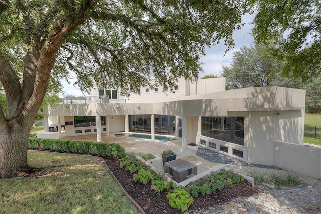 back of property featuring a patio area