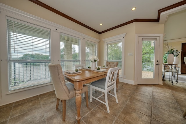 dining area featuring a wealth of natural light and crown molding