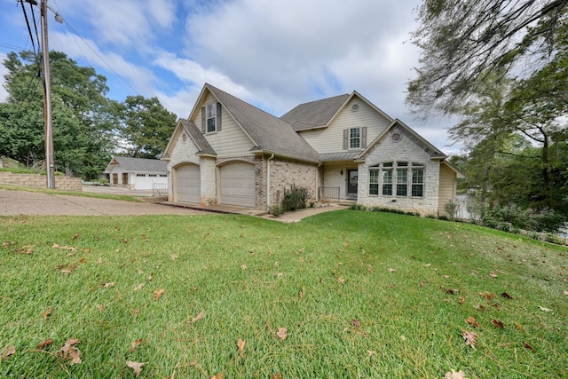 view of front of house featuring a front lawn and a garage