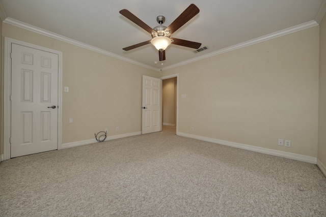 unfurnished room featuring light carpet, ceiling fan, and crown molding