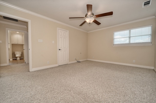 unfurnished bedroom featuring light carpet, crown molding, ensuite bathroom, and ceiling fan