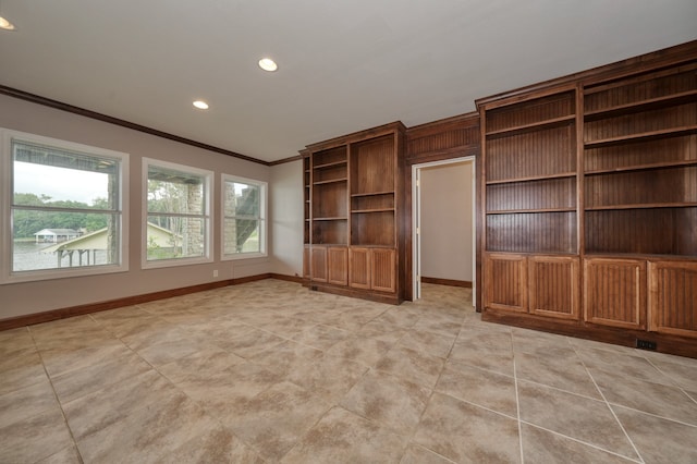 unfurnished living room with ornamental molding