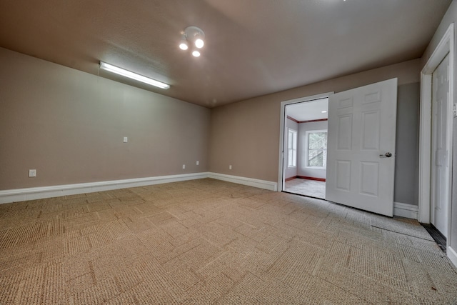 carpeted spare room with ornamental molding