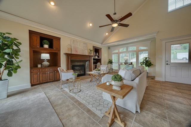 living room with high vaulted ceiling, ceiling fan, crown molding, and a healthy amount of sunlight