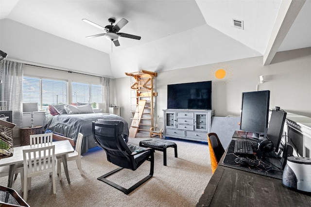 carpeted bedroom with ceiling fan and vaulted ceiling