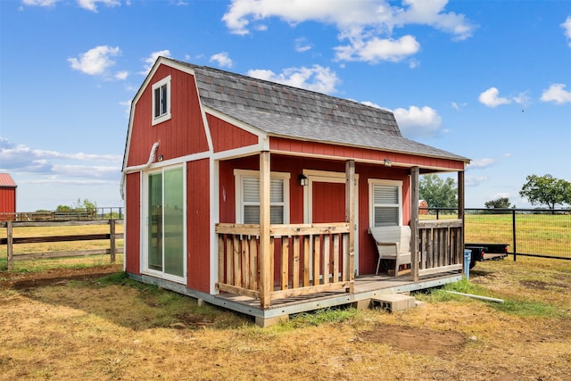 view of outbuilding with a rural view