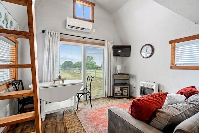 interior space featuring a wall unit AC, heating unit, wood-type flooring, and vaulted ceiling