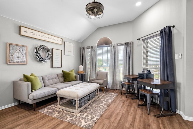 living room featuring hardwood / wood-style floors and lofted ceiling