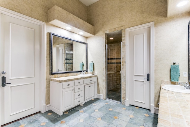 bathroom with an enclosed shower and vanity