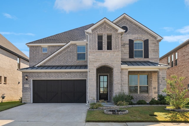 view of front of home with a garage and a front yard