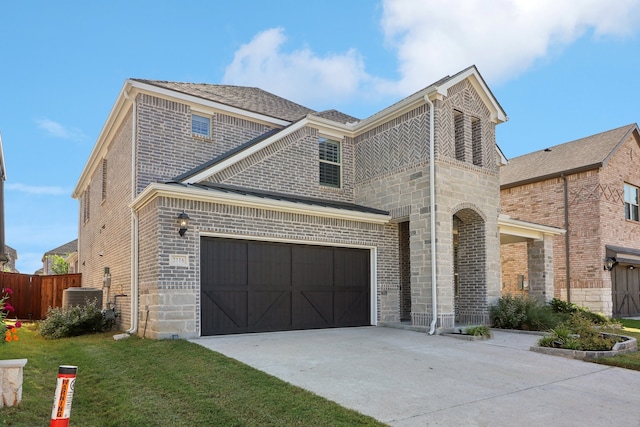 view of property featuring a garage, central AC unit, and a front lawn